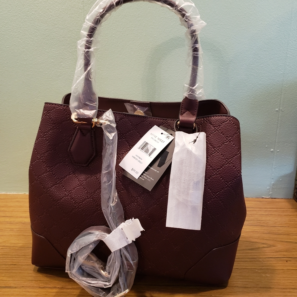 Nine west handbag. New w tags. Originally $99.00 burgundy leather. 14" wide x 10